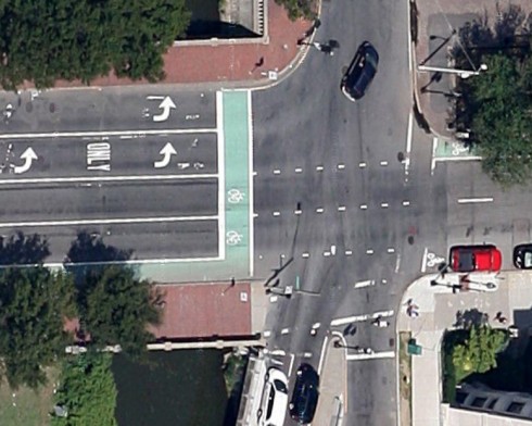 Lane reassignment at Charlesgate East: four usable travel lanes, a musical chairs bike lane, Also note left-side bike lane after the intersection.