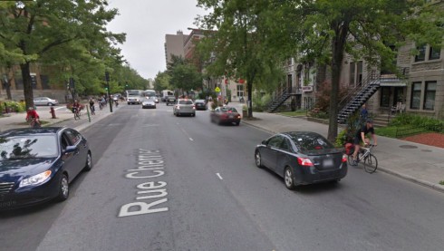 Bicyclist riding opposite traffic on Rue Cherrier