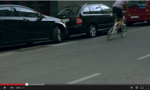 Bicyclist riding in door zone in flipped image