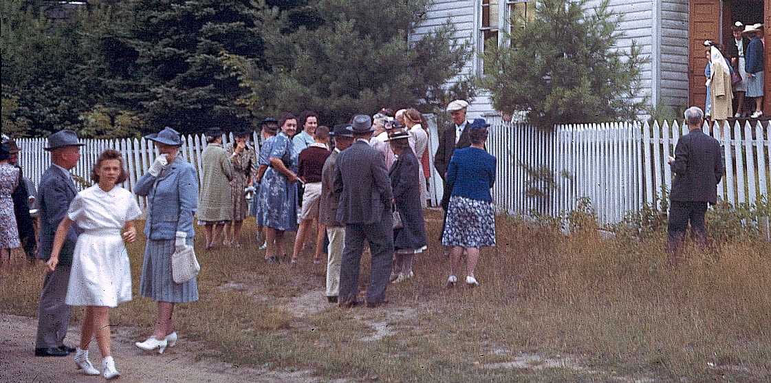 Socializing after church, around 1940